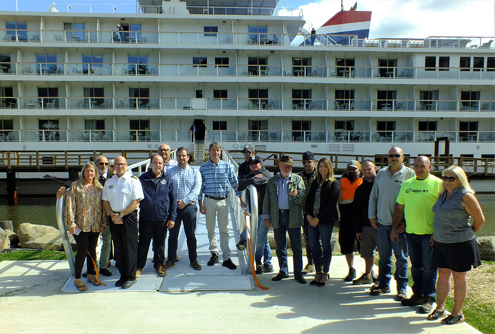 Last week key supporters of bringing cruise ships to Milton attended a ribbon cutting ceremony. Pictured L-R are Penny Cashman, Al Lanzetta, Scott Corcoran, Howard Baker, Eric Dussault, Alan Koenig, Gary Lazaroff, Gael Appler Jr., BJ Mikkelsen,  Dave Zambito, Sherida Sessa, Bruno Keller, Mike Scaturro, John Alone, Charlie Muggeo and Cathy McCredie.